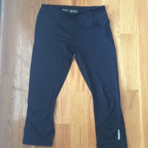 Reebok calf length leggings with mesh in the back.